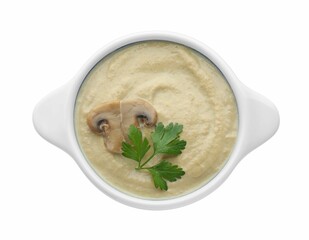 Delicious mushroom cream soup with parsley isolated on white, top view