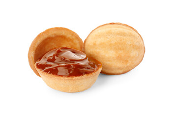 Delicious nut shaped cookies with boiled condensed milk on white background