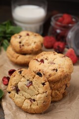Cookies with freeze dried fruits on parchment paper, closeup