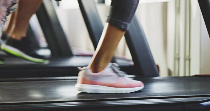 Wellness, health or legs running on treadmill in gym studio for cardio exercise, sport training or workout. Zoom, energy or people on machine for sports fitness, marathon or motivation for event