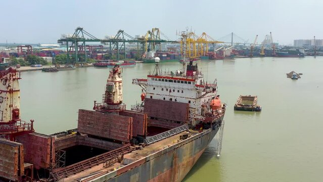 Ho Chi Minh city, Vietnam - May, 2023: Aerial drone view of Cat Lai port with cargo ship and container. Large import-export port important for economic development in Ho Chi Minh City, Vietnam