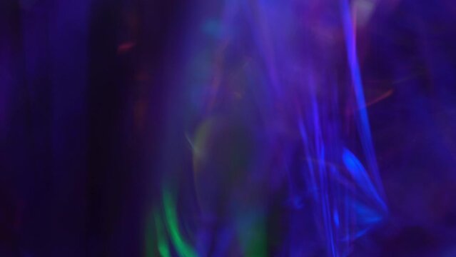 Neon purple, viva magenta, hot pink and dark blue colors ights. Optical Crystal Prism Flare Beams. Lights background or overlay. A magical background for Christmas