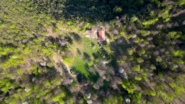 Aerial drone video of a resting place, located in the middle of mountain, surrounded with untouched nature, wonderful place for enjoying and relaxation 4K 60fps