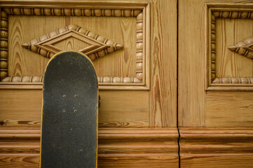 skateboard on decorated light wooden background