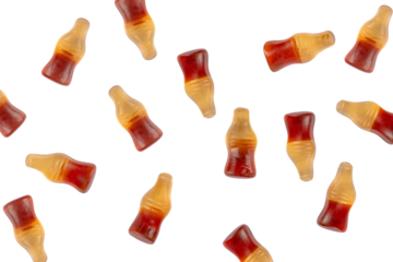 Cola flavored gummy jellies in the shape of cola bottles,isolated over transparent background.