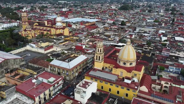 Catholic church at front and Cathedral of Orizaba in the back in downtown, orbit shot
