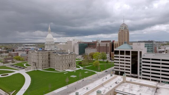 Michigan State Capitol building in Lansing, Michigan with drone video moving sideways from right to left.