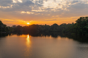 Obraz na płótnie Canvas Amazon rainforest sunrise by Garzacocha Lagoon, Yasuni national park, Ecuador.