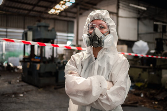Portrait industry worker with safety uniform protective wearing gas mask to safe before start work to check chemical or gas in factory is industry safety concept.