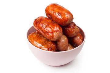 Plate with fried meat sausages on a white background. Fried sausages made from fresh natural meat.