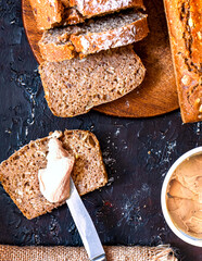 Whole grain piece of bread spread with salmon pate