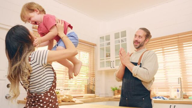 Caucasian family spending leisure free time together indoors in house.