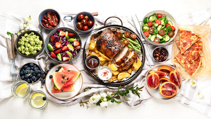 Family dinner or lunch. Many dishes on the table. Top view, copy space