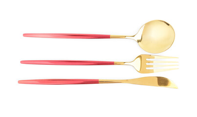 Golden cutlery with red handles on white background
