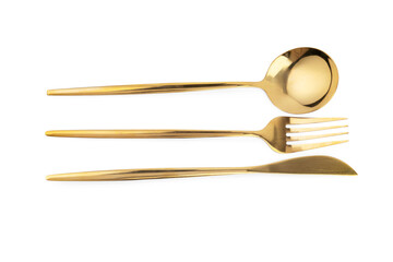 Golden cutlery on white background