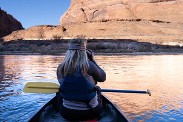 Kayaking / Canoeing on the river, a very peaceful ride down calm waters as the woman photographed the surroundings. 