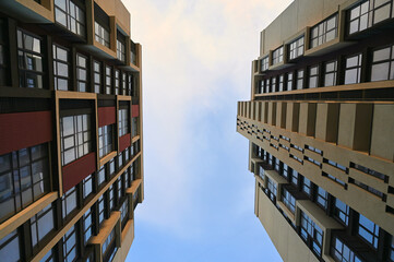 A new modern urban building stands tall, with sleek lines and a striking architectural design. It's...
