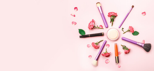 Makeup and cosmetic beauty products arranged on a pink background. Flat lay. Beauty concept