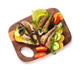 Wooden board of tasty sandwiches with canned smoked sprats on white background