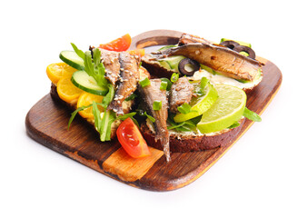 Wooden board of tasty sandwiches with canned smoked sprats on white background