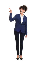 Beautiful businesswoman in suit pointing at something on white background