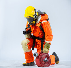 The bright yellow helmet and gloves of the firefighter stand out against the pristine white background emphasizing their role as a protector and guardian in the face of danger.