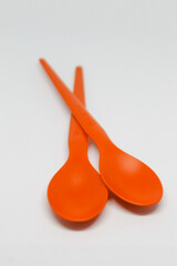 isolated photo of red ice cream spoon on white background