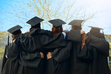 Embrace, group of graduates and together with joy on graduation day or celebrating academic achievement and outdoors. Certification, young students and hug outside or robes or hats and education