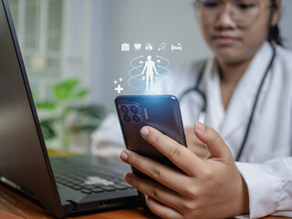 Doctors use smartphones and computers to research medical information. medical concept