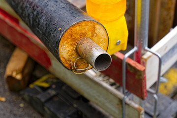Close-up of pipe at repair site of district heating at City of Zürich district Schwamendingen on a...