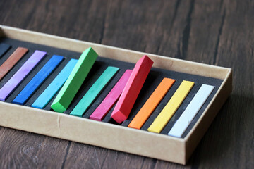 A box of pastel chalks. many different colours in a pastel chalk box