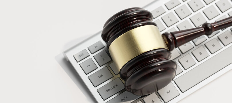 Digital Law Legal System Justice Crime concept. Mallet Gavel on keyboard. 3d Render illustration