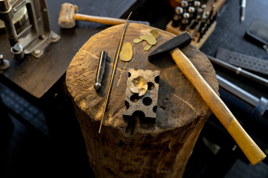 Close up of wooden trunk with tools and materials in jewellery workshop