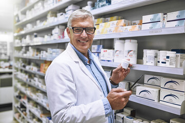 Pharmacy, medicine and tablet with portrait of man at shelf in store for stock, inspection and inventory. Medical, healthcare and pills with senior pharmacist for technology, wellness and product