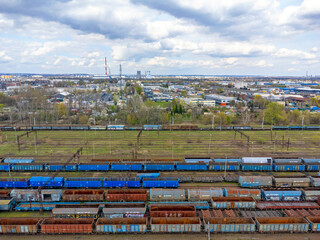 Aerial view landscape. View of old trains, depot, railroad tracks, cargo. 
