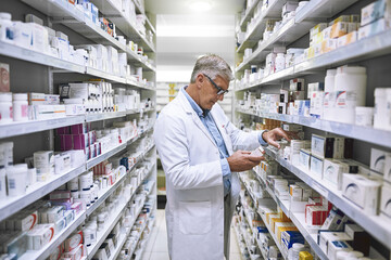 Pharmacy, medicine and search with man at shelf in drug store for thinking, inspection and...