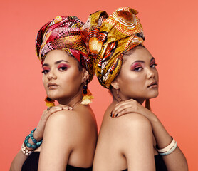 African fashion, cosmetics and portrait of women on orange background with accessory, makeup and...