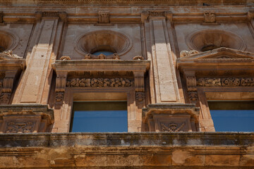 Fototapeta na wymiar Windows of Alhambra Red Palace in Grenada Spain