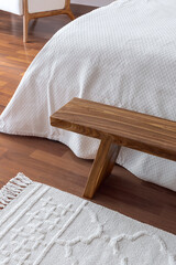 Fototapeta na wymiar Handmade elm bench in the bedroom