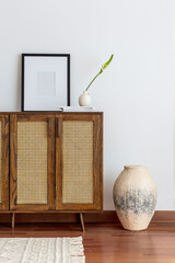 Handmade rattan chest of drawers with papier mache vase