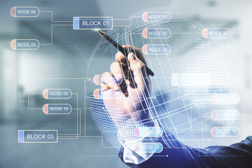 Double exposure of man hand with pen working with abstract creative programming illustration and world map on blurred office background, big data and blockchain concept