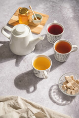 A tea set with sugar and honey