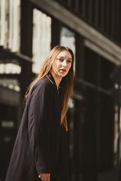 The white beautiful girl walks upon the street