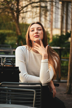 The white beautiful girl up shows her light blue nails up close