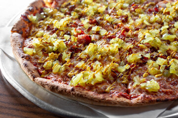 A view of a pastrami pizza.