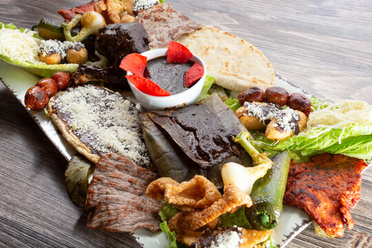 A view of a large platter of Mexican food. - Powered by Adobe