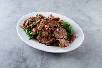 A view of a plate of beef broccoli.