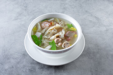 A view of a bowl of wonton soup.
