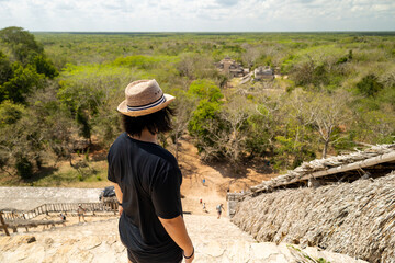 A girl in the top Acropolis in ancient city of Maya Ek Balam