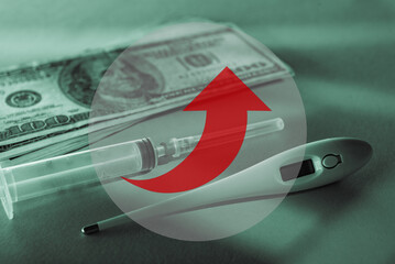 Syringe, electronic thermometer and dollars banknotes with red arrow moving up